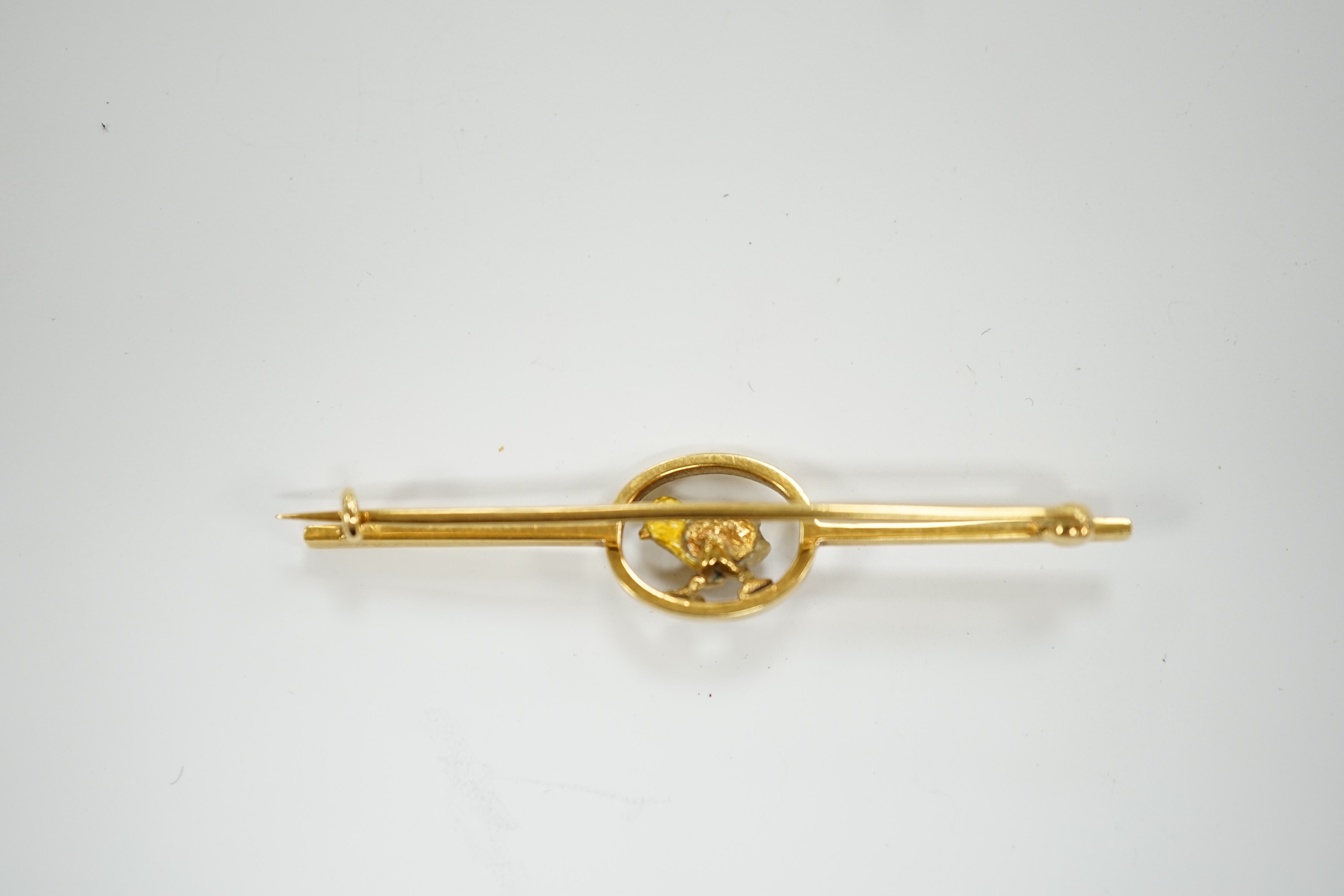 An early 20th century yellow metal, enamel and single stone baroque pearl set bar brooch, modelled as a hatching chick, 50mm, gross weight 3.8 grams.